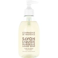 Clear bottle of Compagnie De Provence Liquid Marseille Soap with white pump, labeled Cedar Forest, 300 ml.