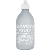 Frosted glass bottle of Compagnie De Provence Liquid Marseille Soap Delicate, 300 ml, with white pump dispenser.