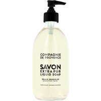 Clear bottle of Compagnie De Provence Liquid Marseille Soap, black pump, bold black text, 495 ml for sensitive skin.