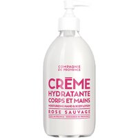 White bottle of Compagnie De Provence Wild Rose Body and Hand Cream with pink text and pump dispenser.