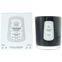Black Creed Birmanie Oud candle in glass holder with white label, next to matching white box with logo and text.