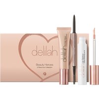 Delilah Beauty Heroes Trio with peach packaging, mascara, eyeliner, and lip gloss in sleek rose gold accents.