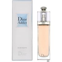 Clear glass bottle with silver cap, containing pink Dior Addict Eau de Toilette, next to matching branded box.