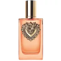 Amber bottle of Dolce & Gabbana Devotion Intense Eau De Parfum, gold cap, ornate heart emblem on front.