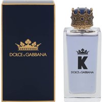 Clear glass bottle with blue liquid, crowned cap, and "K" logo, next to a navy box with gold Dolce & Gabbana branding.