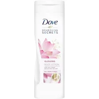 White Dove body lotion bottle with pink lotus design, labeled "Nourishing Secrets Glowing Ritual" 400ml.