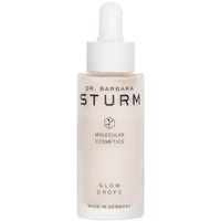 Clear glass bottle with white dropper, labeled "Dr. Barbara Sturm Glow Drops" in black text, 30ml size.