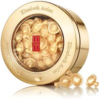 Gold jar of Elizabeth Arden Advanced Ceramide Capsules with translucent pearl-like capsules for eye care.