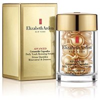 Gold jar of Elizabeth Arden Advanced Ceramide Capsules with matching box, containing 30 pearl-like serum capsules.