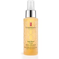 Clear bottle of Elizabeth Arden Eight Hour Miracle Oil with spray nozzle and gold circular design.