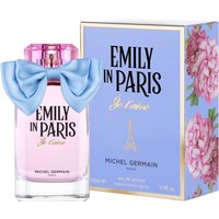 Pink perfume bottle with blue bow, labeled "Emily in Paris Je t’aime," next to floral-accented box.