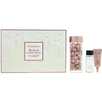 Elizabeth Arden Nightly Performance Retinol Set with capsules, serum bottle, and pink tube in decorative box.