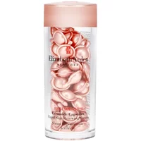 Elizabeth Arden serum in clear jar with pink lid, containing pink pearlescent capsules.