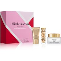 Pink and red Elizabeth Arden gift set with cream tube, gold capsule bottle, and white jar with gold lid.