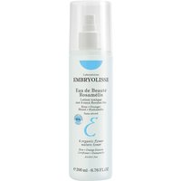Clear bottle of Embryolisse Eau De Beaute Rosamelis 100 ml with white cap and blue text on label.