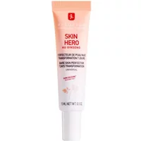 Erborian Skin Hero cream tube, 15ml, white with peach gradient, red logo, and text detailing skin-perfecting benefits.
