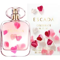 Clear glass bottle of Escada Celebrate N.O.W. Eau De Parfum with pink heart accents, 80ml size.