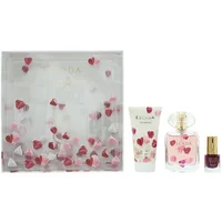 Escada gift set with heart-themed lotion, perfume bottle, and red nail polish in a decorative box.