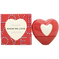 Red heart-shaped Escada Show Me Love Eau De Parfum bottle with matching box featuring white heart design.