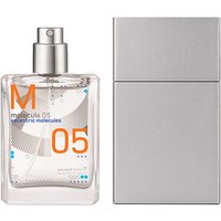 Clear glass bottle of Molecule 05 perfume with silver cap, orange text, and minimalist gray packaging.