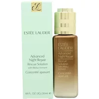 Estée Lauder serum in a brown gradient bottle with gold cap, next to a light green box with gold logo.
