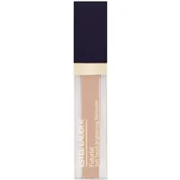 Transparent tube of Estée Lauder concealer with navy cap, gold accents, and beige liquid inside.