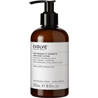 Brown bottle of Evolve Beauty hand and body lotion with black pump and white label detailing ingredients.