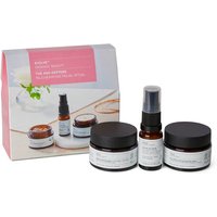 Skincare set with brown jars, black lids, and a spray bottle, next to a pink and white box.