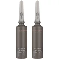 Dark gray Exuviance Wrinkle Smooth Topical Peptide vials with clear caps, sleek design, white text.