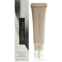 Fenty Beauty Bright Fix Eye Brightener Seashell in beige tube with clear cap, next to speckled gray box.