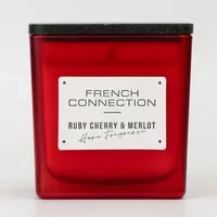Red glass candle with black lid, labeled "French Connection Ruby Cherry & Merlot" in white and black text.