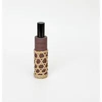 Black French Connection room spray with bamboo lattice design, 100ml bottle, labeled Black Cherry & Cedarwood.