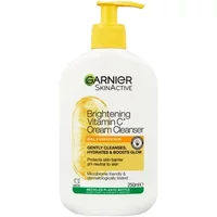 Garnier Brightening Vitamin C Cream Cleanser 250ml with yellow pump and citrus design on white bottle.