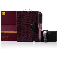 Cherry red ghd hair dryer brush set with textured case, black brush, and styling products.