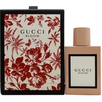 Gucci Bloom Eau De Parfum 50ml bottle with blush pink cap, floral-patterned box in red and white.