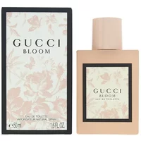Gucci Bloom Eau De Toilette 50ml with floral box, beige rectangular bottle, and black-bordered label.