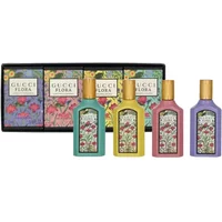 Gucci Flora Miniature Gift Set with four colorful 5ml bottles, floral designs, and matching decorative box.