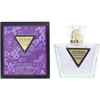 Clear glass bottle with gold cap, purple liquid, and triangular label; purple floral box beside it.