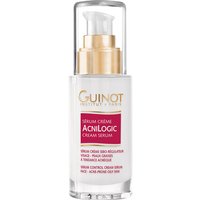 Clear bottle of Guinot Serum Creme AcniLogic 30ml with gold pump and red label.