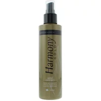 Harmony Gold Heat Defence Spray 200ml in a bronze bottle with black pump and cap, featuring bold black text.