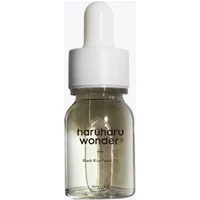 Clear glass bottle with white dropper cap, containing Haruharu Wonder Black Rice Facial Oil, 10ml.