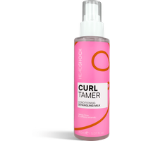 Pink Head Shock Curl Tamer Detangling Milk bottle, 150 ml, with white pump and orange swirl design.