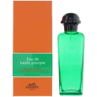 Green Hermès Eau De Basilic Pourpre cologne bottle with black cap next to orange and green box.