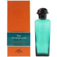 Green Hermès Eau D'Orange Verte cologne bottle with black cap, next to orange box with teal accents, 100ml size.