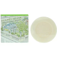 Hermès Un Jardin Sur Le Toit Soap 100g, round ivory bar with embossed logo, green and white illustrated box.