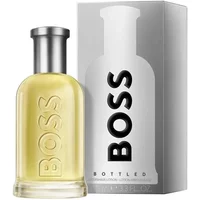 Clear glass bottle of Hugo Boss Bottled Aftershave 100ml with silver cap, next to a sleek silver box.