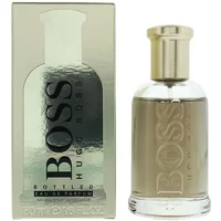 Hugo Boss Bottled Eau De Parfum 50ml with gold cap, clear glass bottle, and sleek metallic packaging.