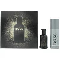 Hugo Boss Bottled Parfum Gift Set with black parfum bottle and silver deodorant spray next to a dark gift box.