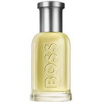 Clear glass bottle with "BOSS" embossed, silver cap, containing light yellow Hugo Boss Bottled Eau de Toilette, 200ml.