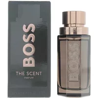 Hugo Boss The Scent Le Parfum For Him, 50ml bottle with sleek metallic cap and dark glass, next to matching box.